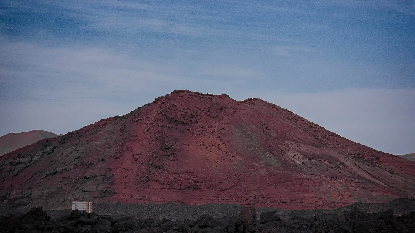 A red volcanic cone in Timanfaya National Park, Lanzarote