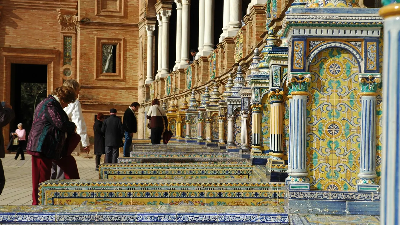 The curved brick colonnade and canal of the Plaza de España in Seville